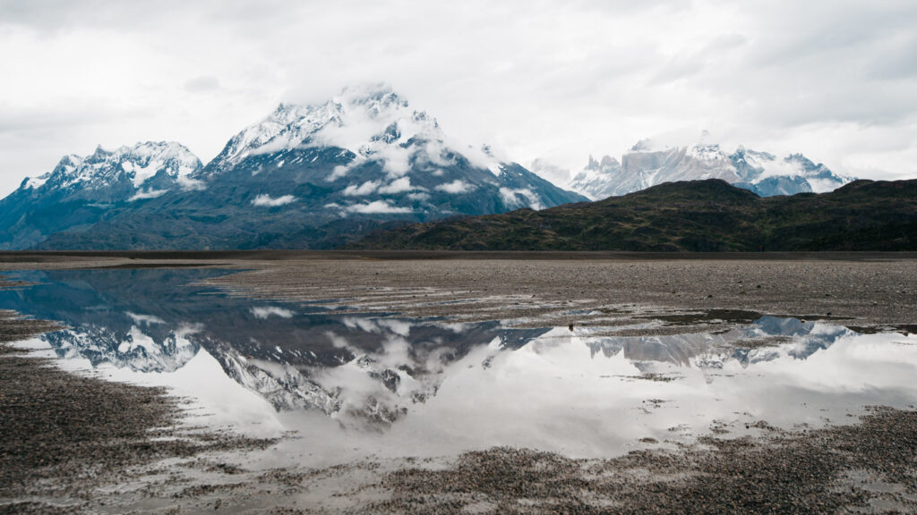 Reflection of the Torres del Paine on the south shore of Lago Grey