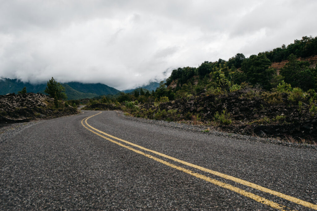Endless windy road in Chile Parque Nacional Conguillio Volcan Llaima-