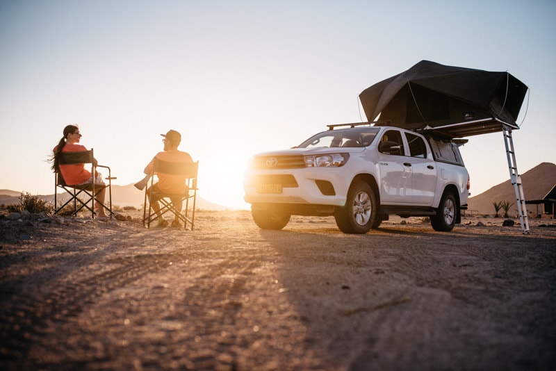 Camping in Namibia while enjoying a sunset