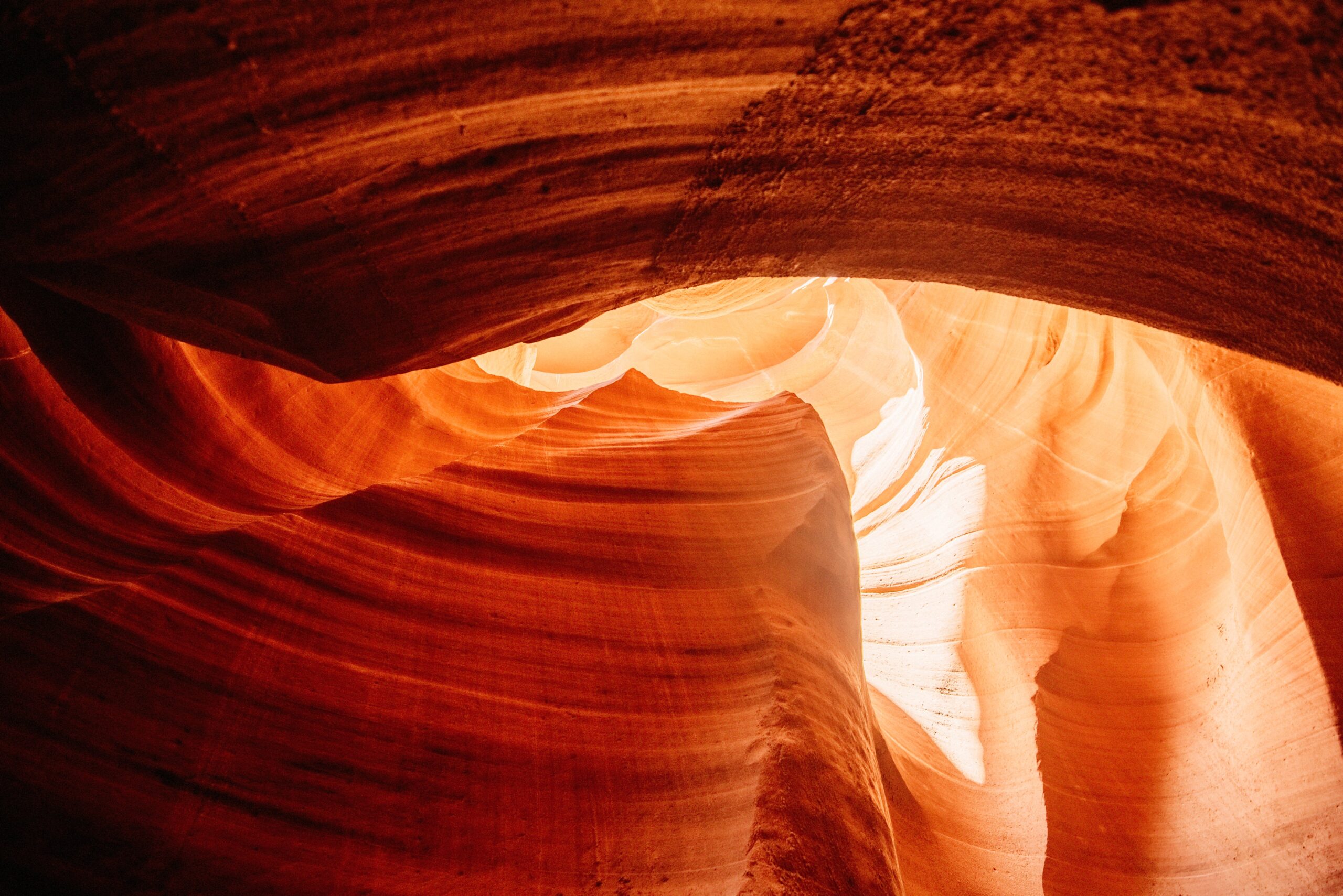 Layered sandstone curves inside the slot canyon