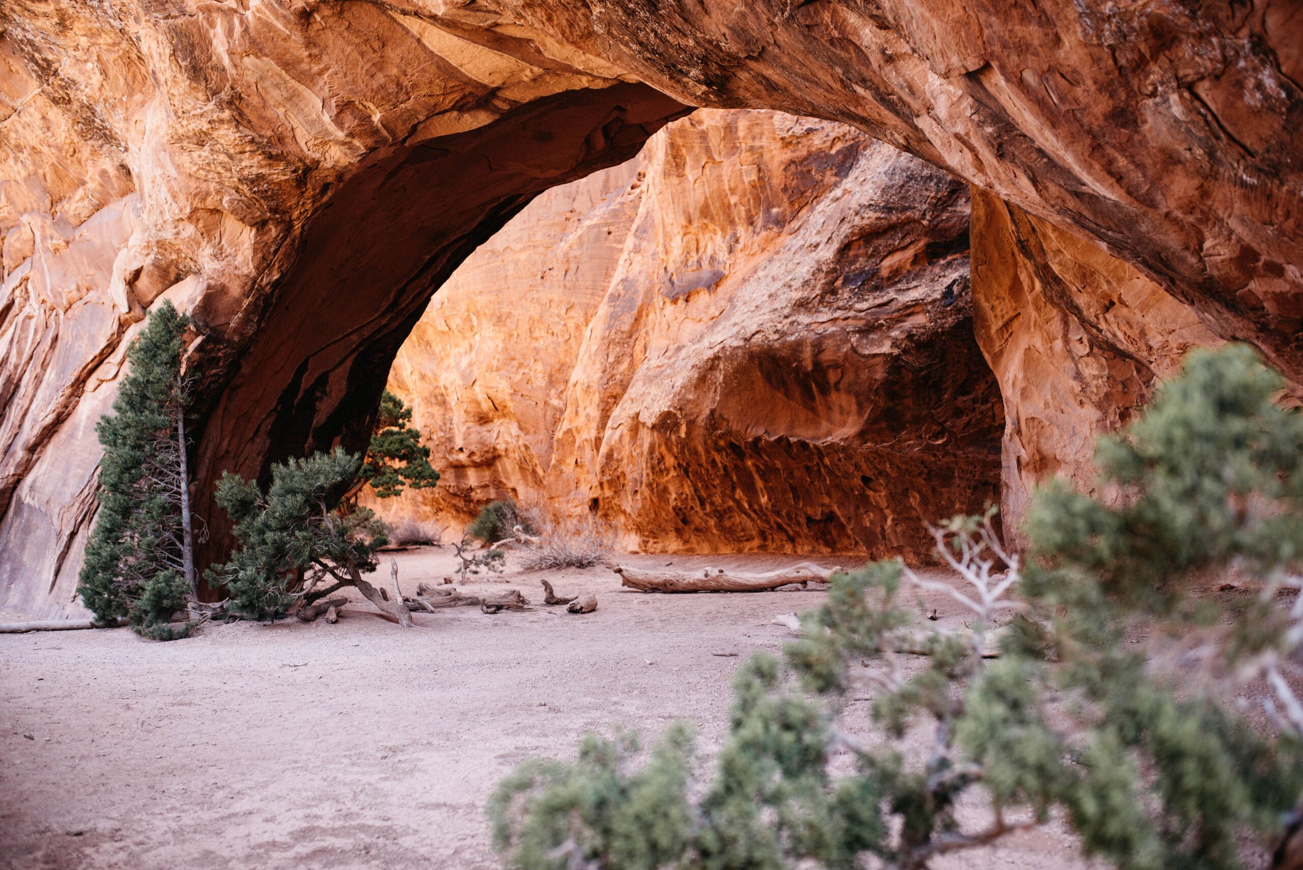 Warm sandstone light beneath Navajo Arch