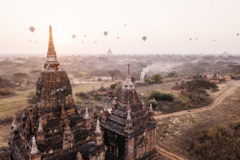Hot-air balloons floating above the temples of Bagan at sunrise