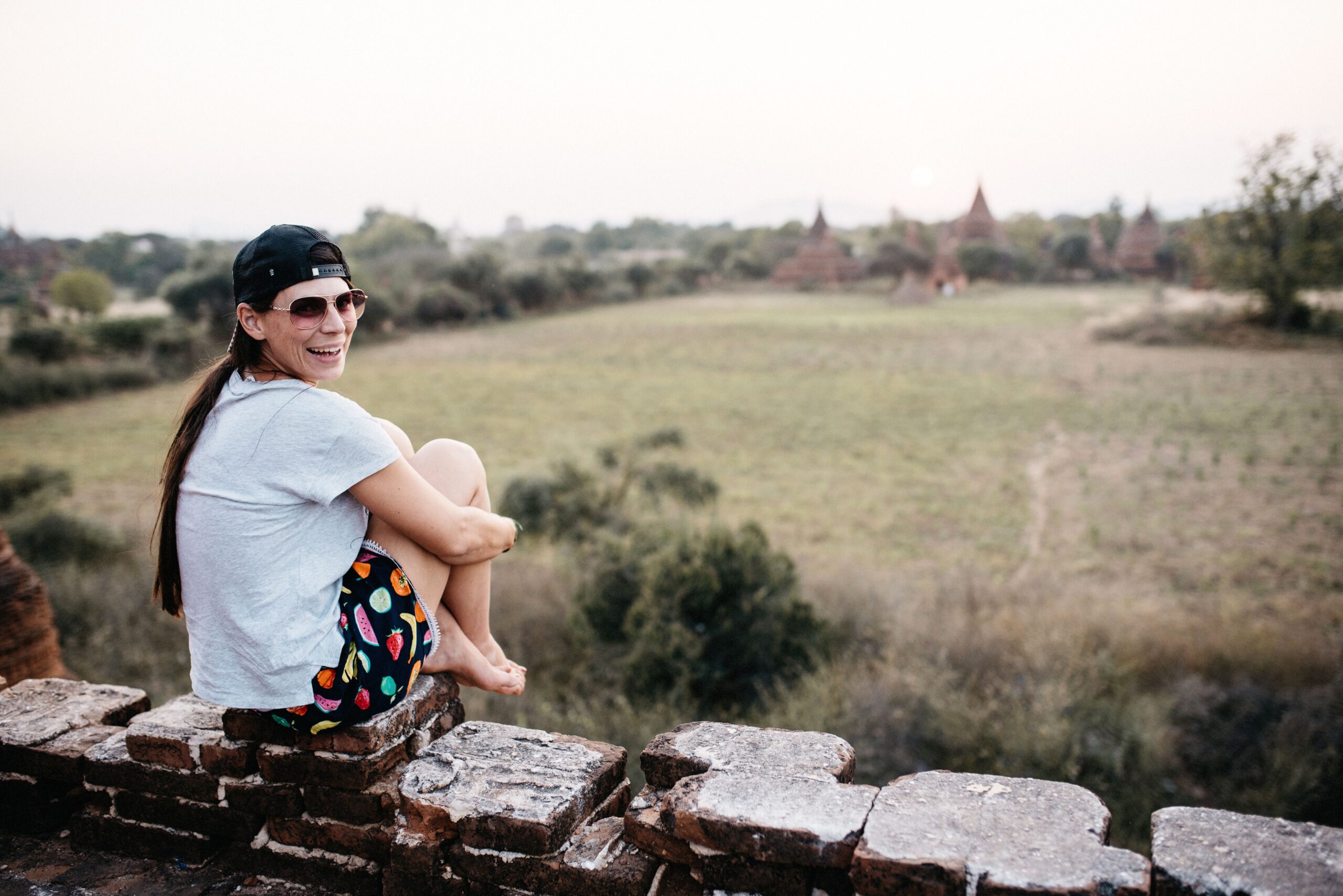 Bianca looking across the temple plain from a brick viewpoint in Bagan