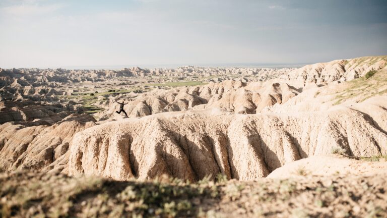 Tom standing among the eroded ridges of Badlands National Park
