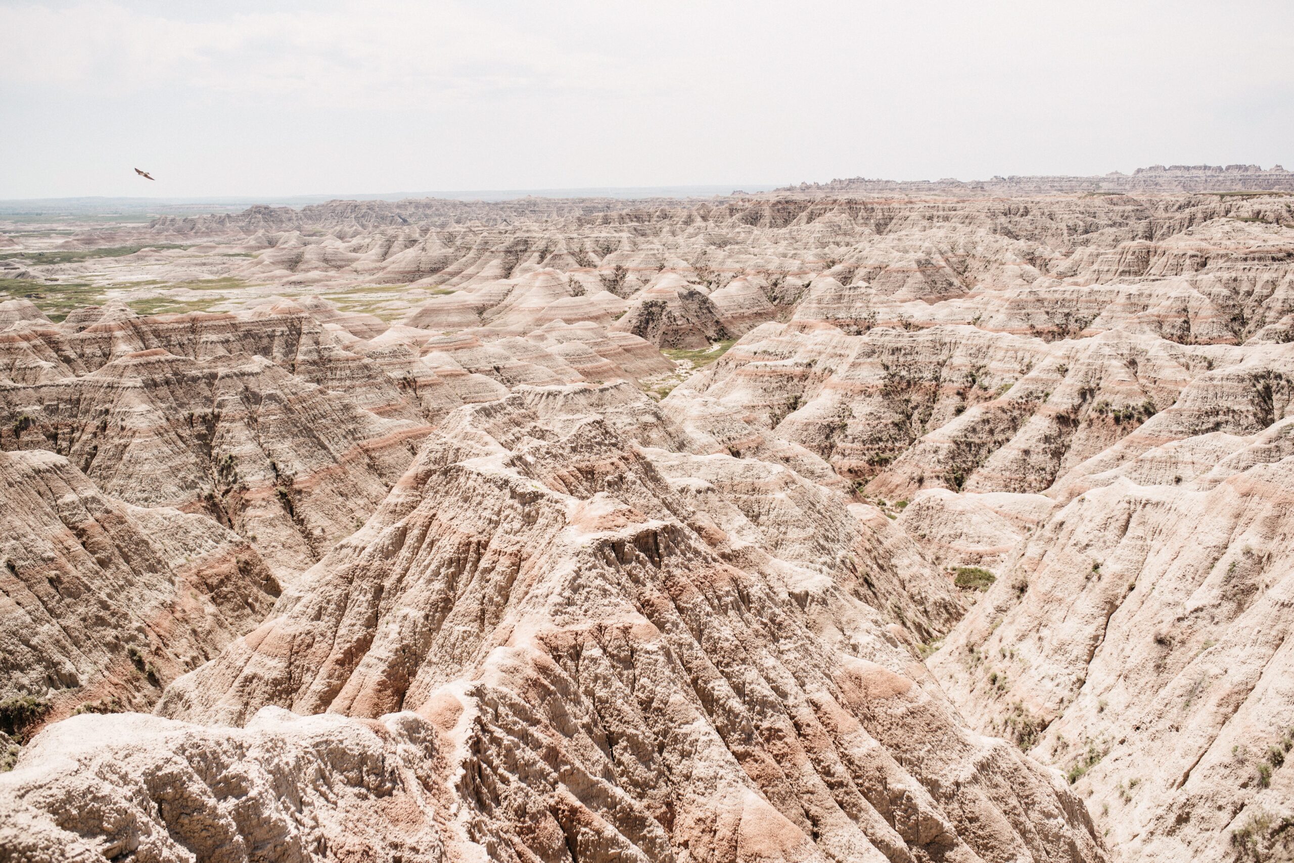 A wide view over the layered formations of Badlands National Park