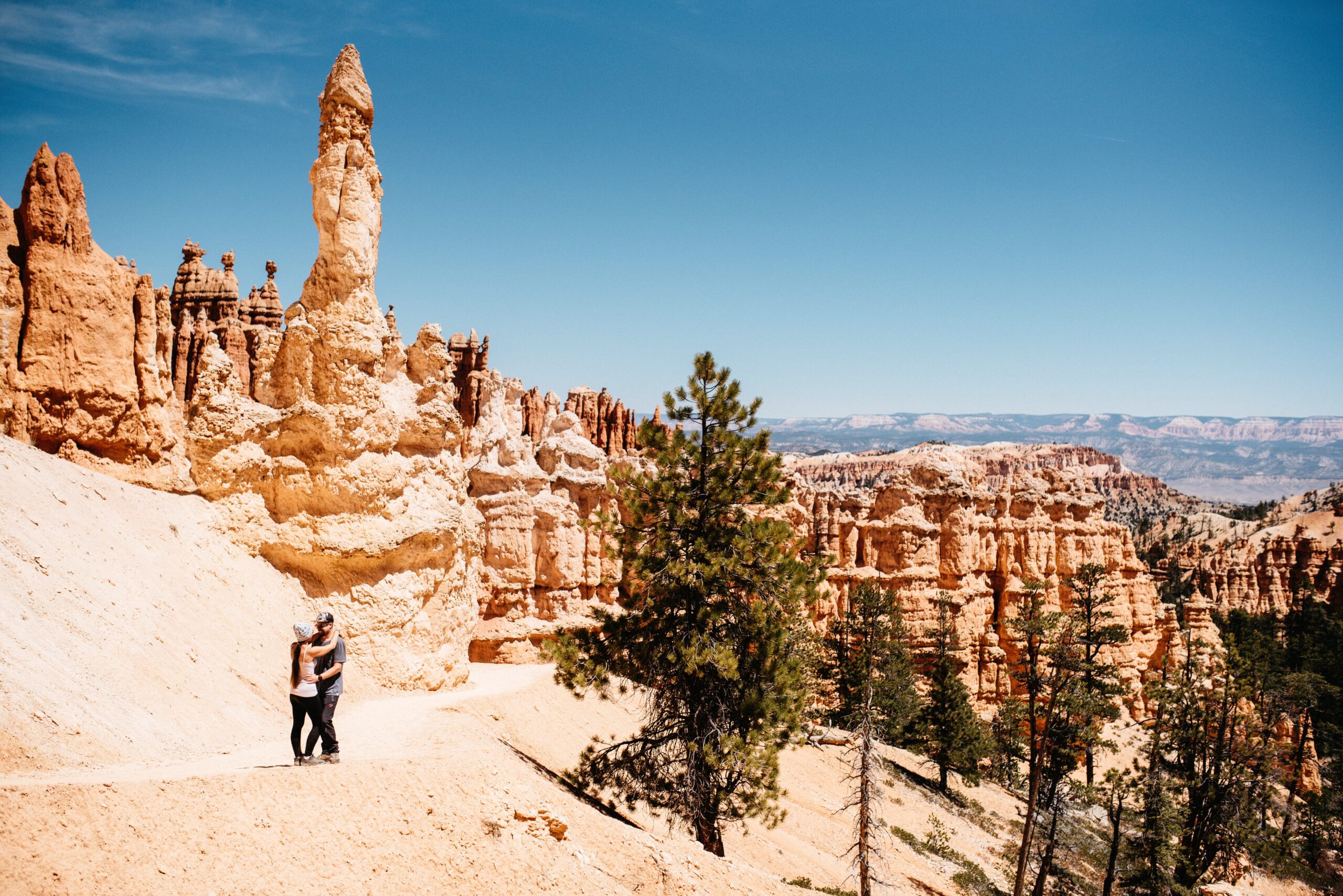 Bianca hiking below the tall hoodoos on the Queen's Garden Trail