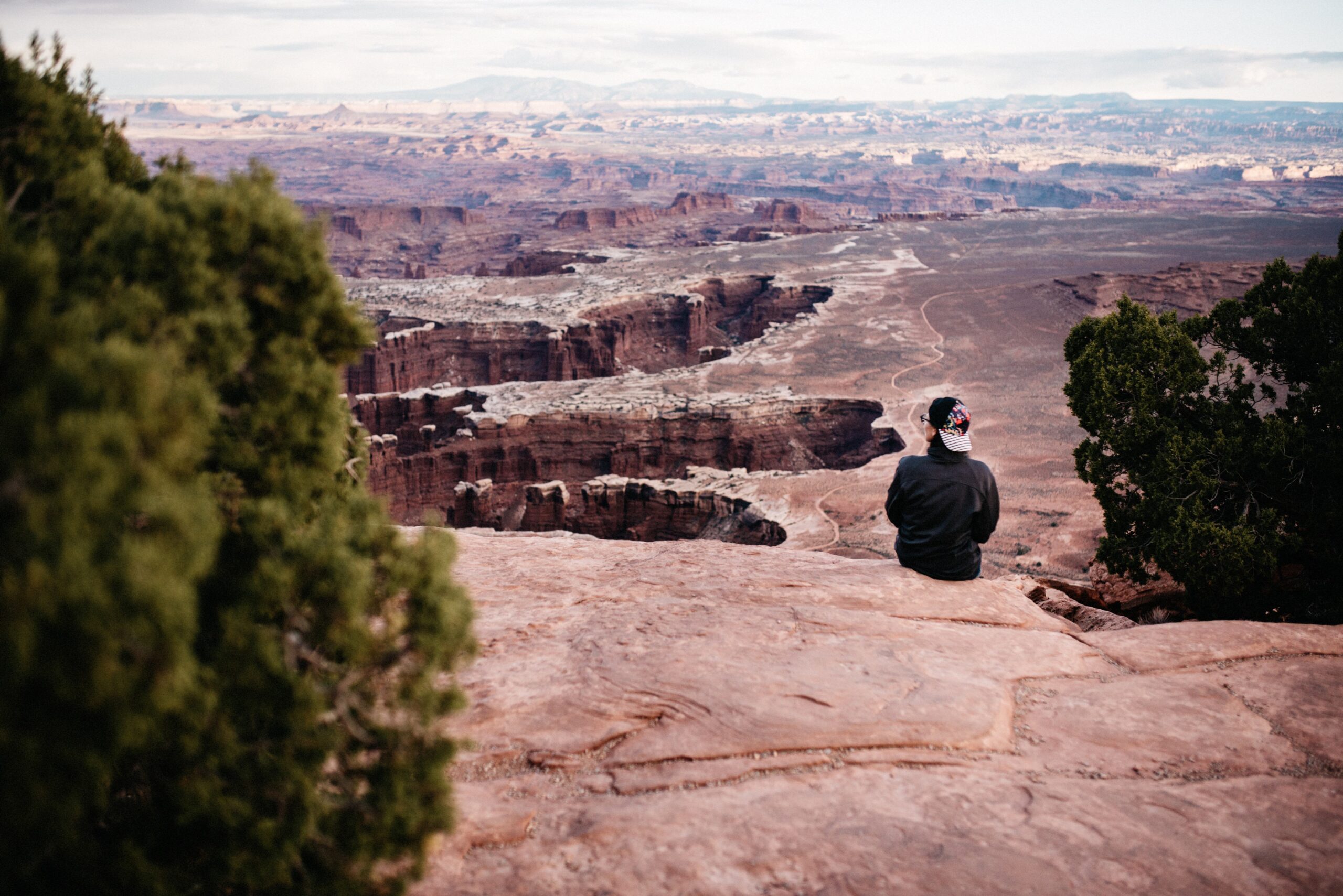 Tom looking across Canyonlands from Orange Cliffs Overlook