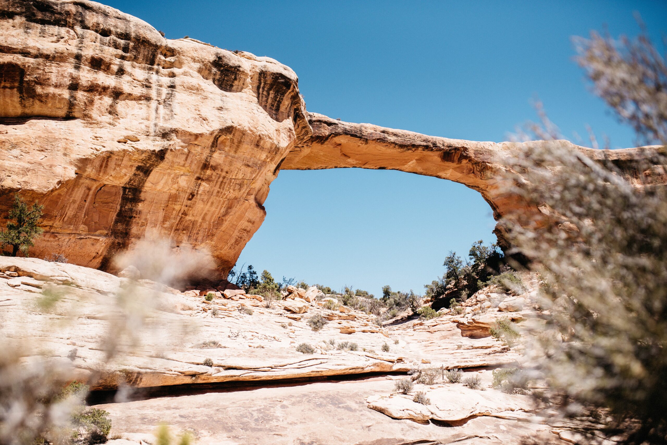 A natural sandstone bridge along the road beyond the Needles