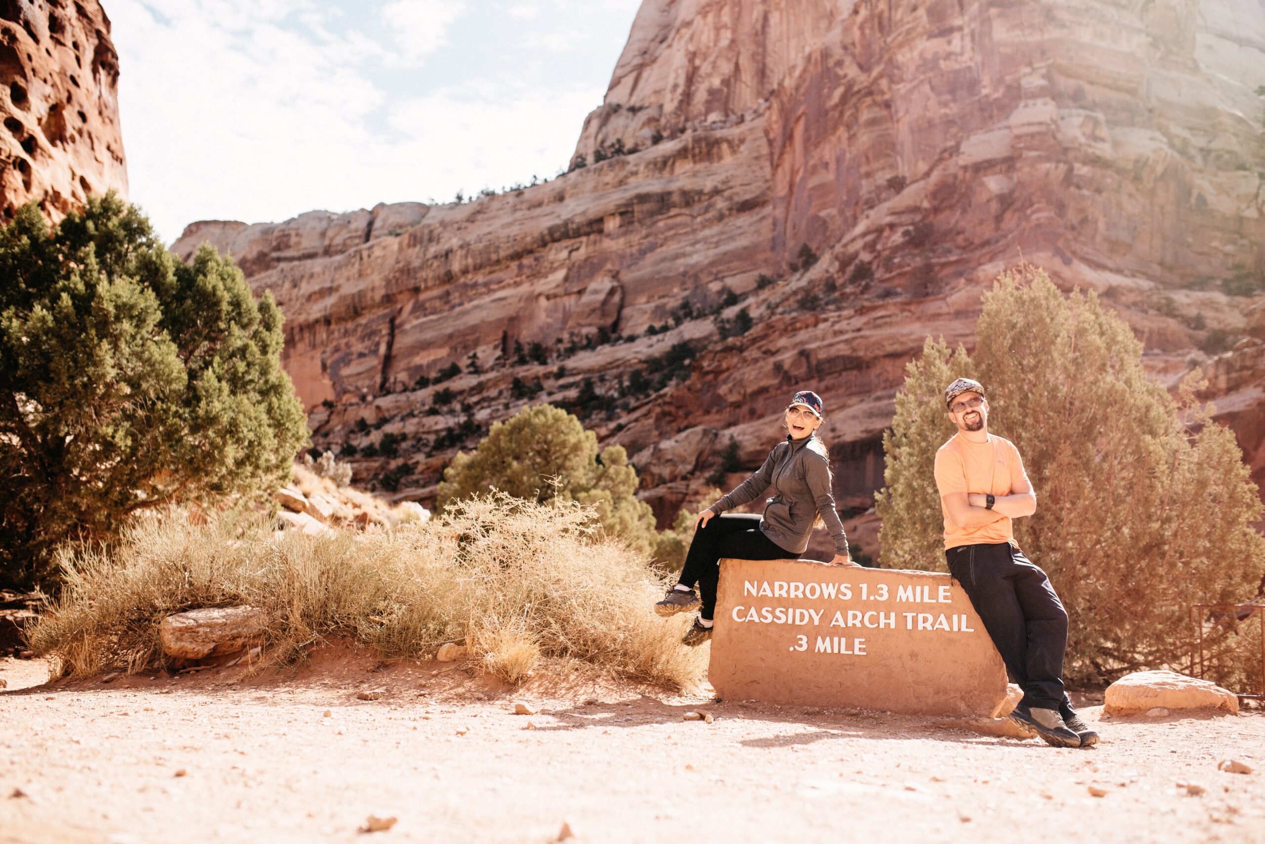 Bianca and Tom at the Cassidy Arch trailhead in Capitol Reef