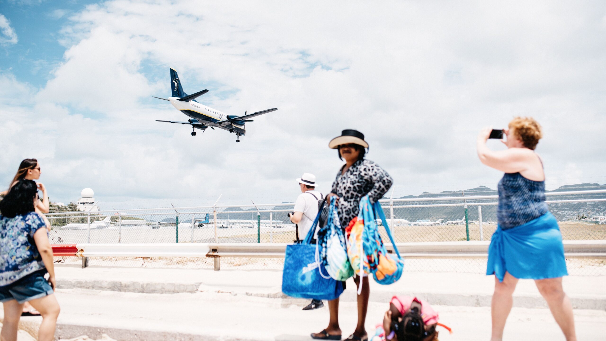 An aircraft flying low above Maho Beach in Sint Maarten