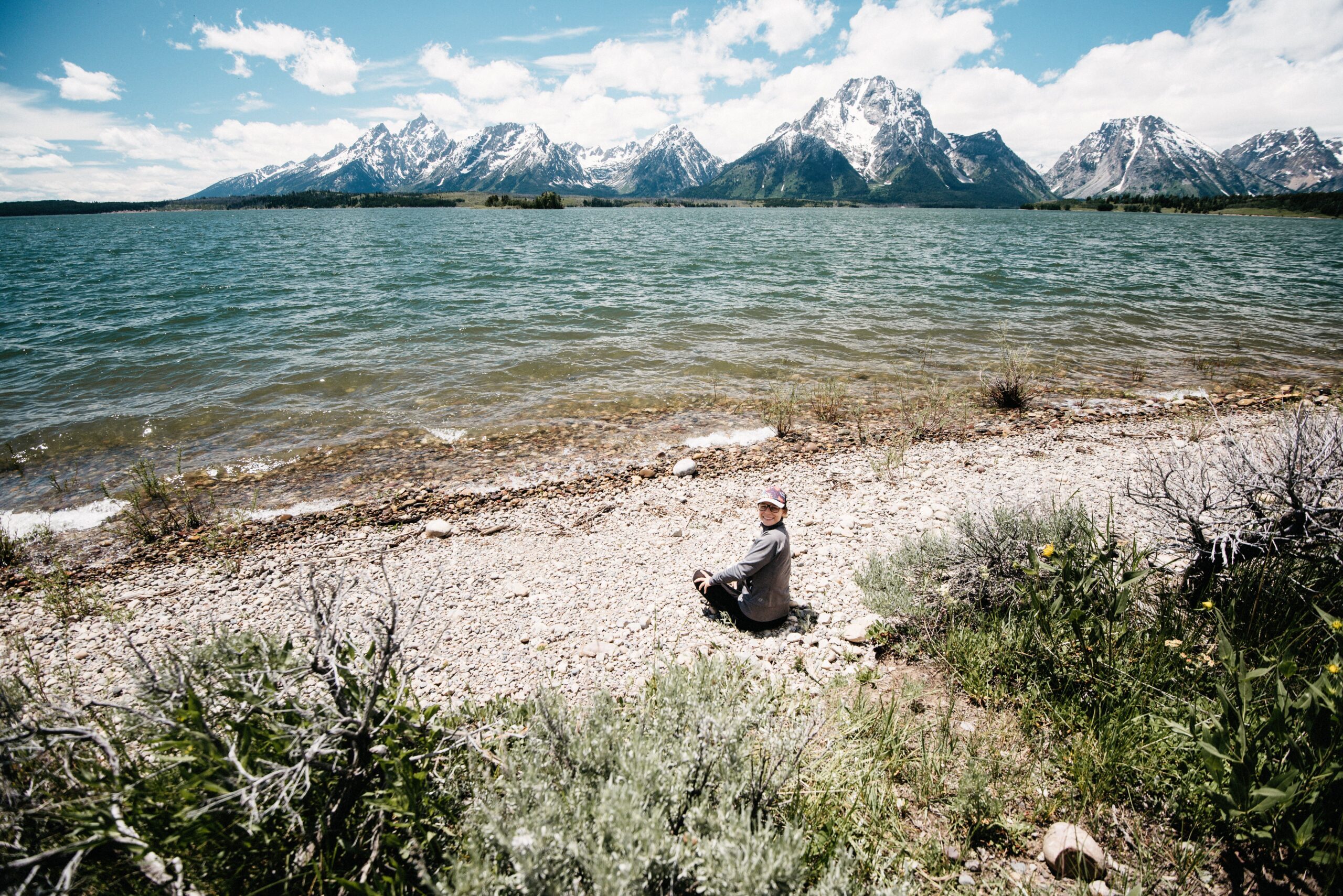Bianca sitting on the shore of Jackson Lake