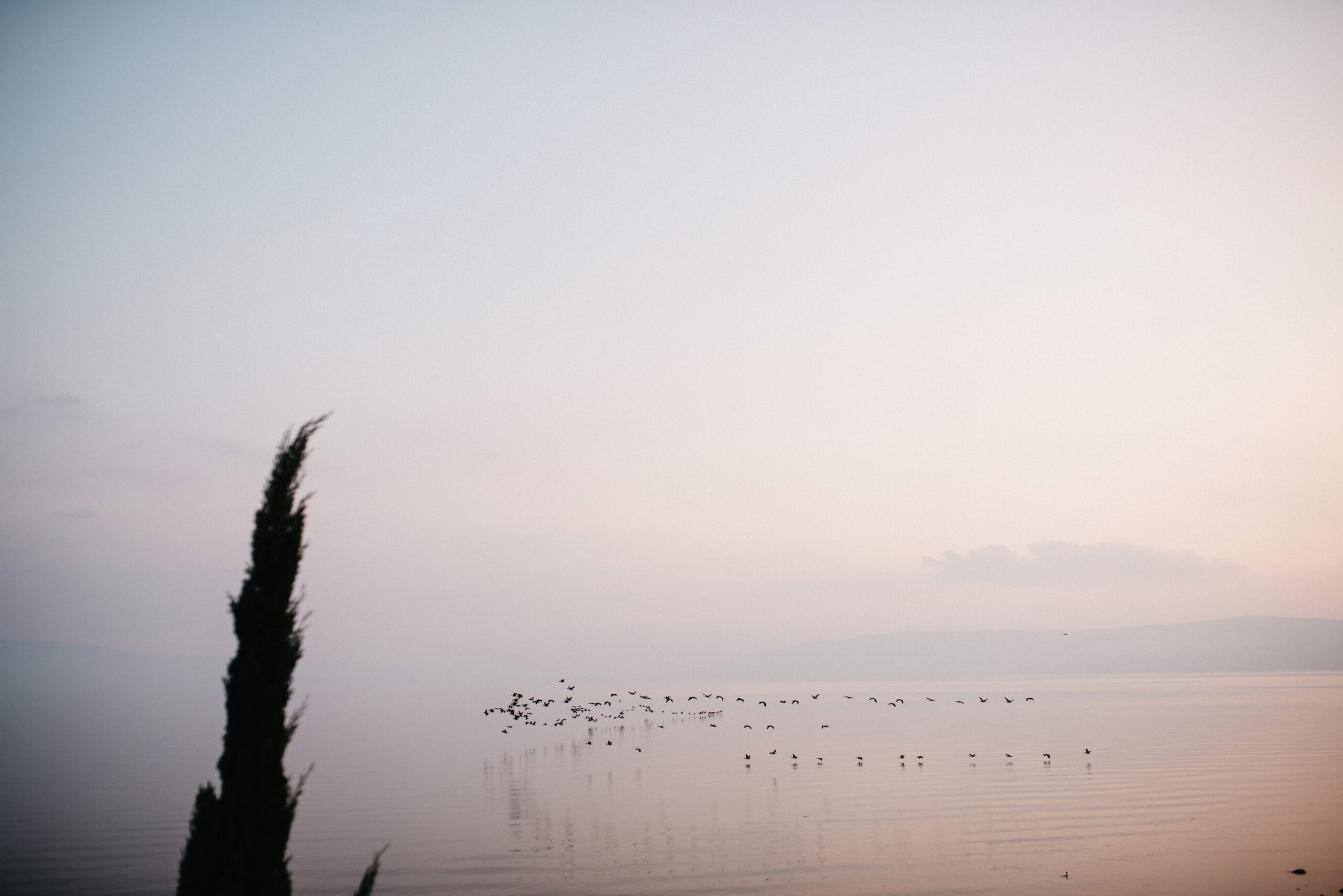 The calm Sea of Galilee in soft winter light