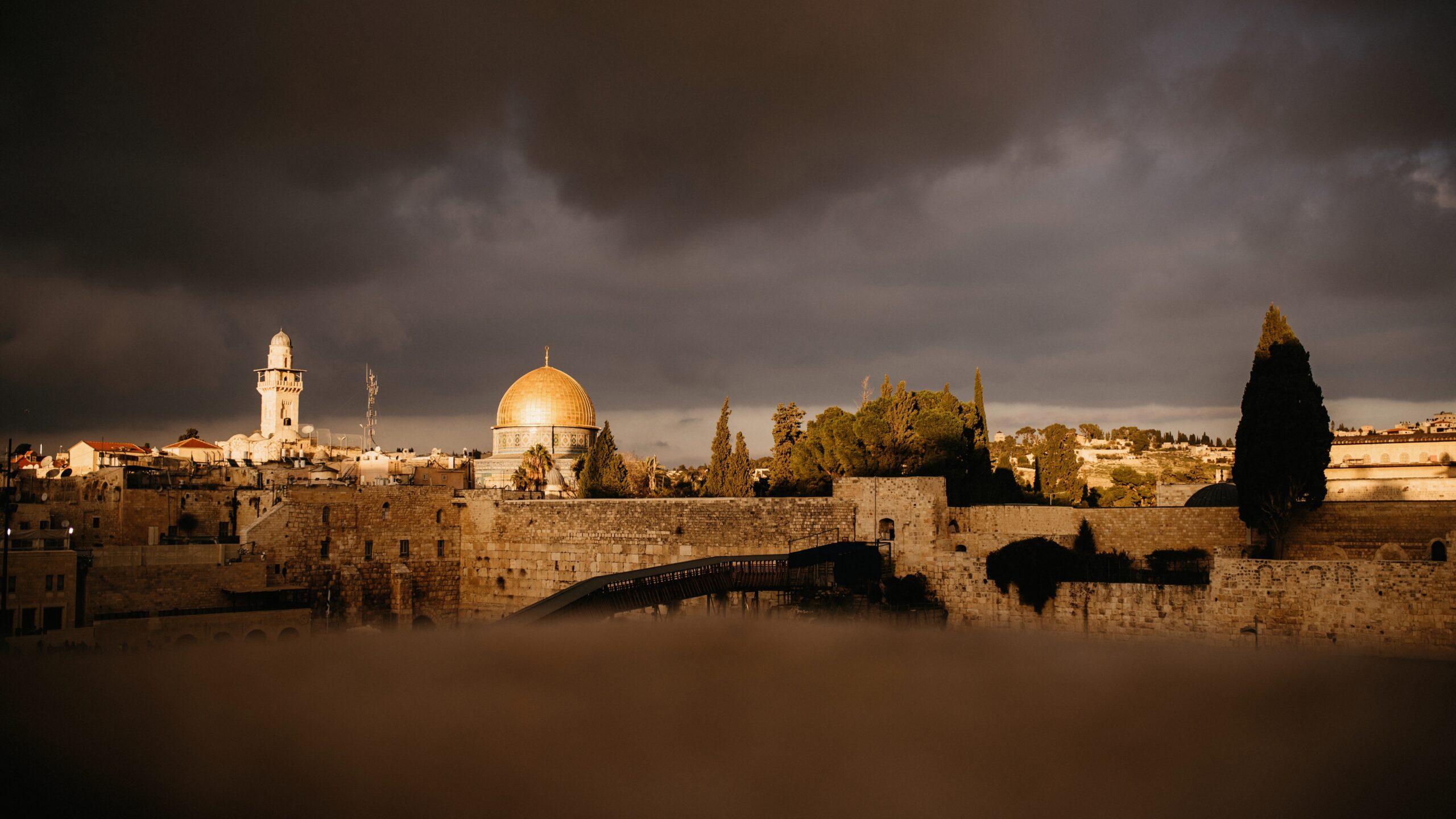 The Dome of the Rock glowing above Jerusalem after dark