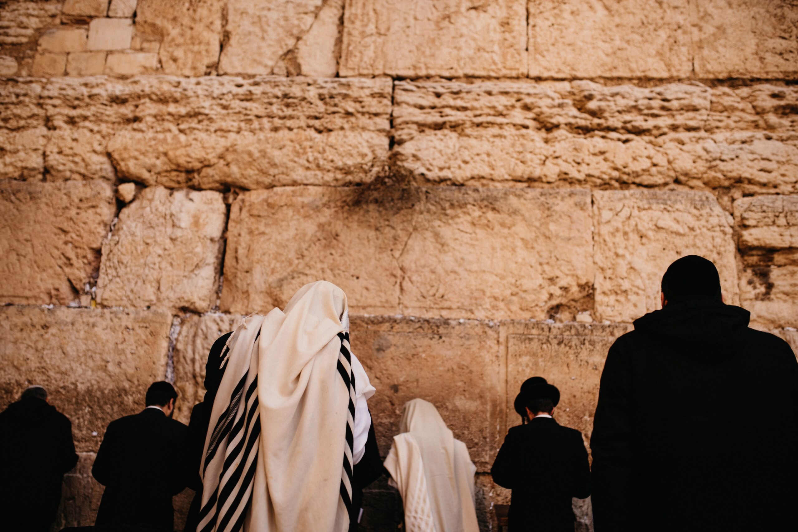 Worshippers standing at the Western Wall in Jerusalem
