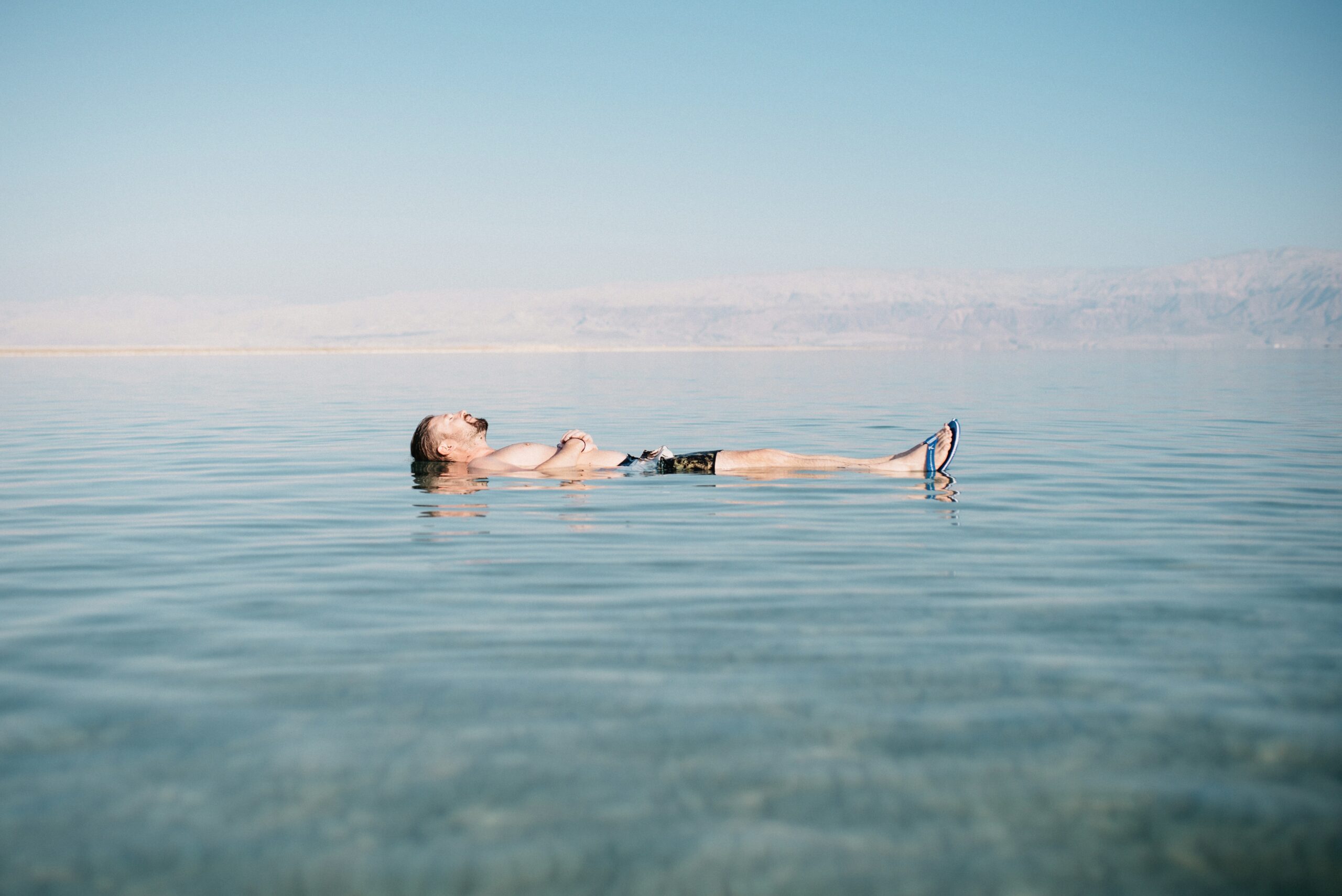 Tom floating on his back in the Dead Sea