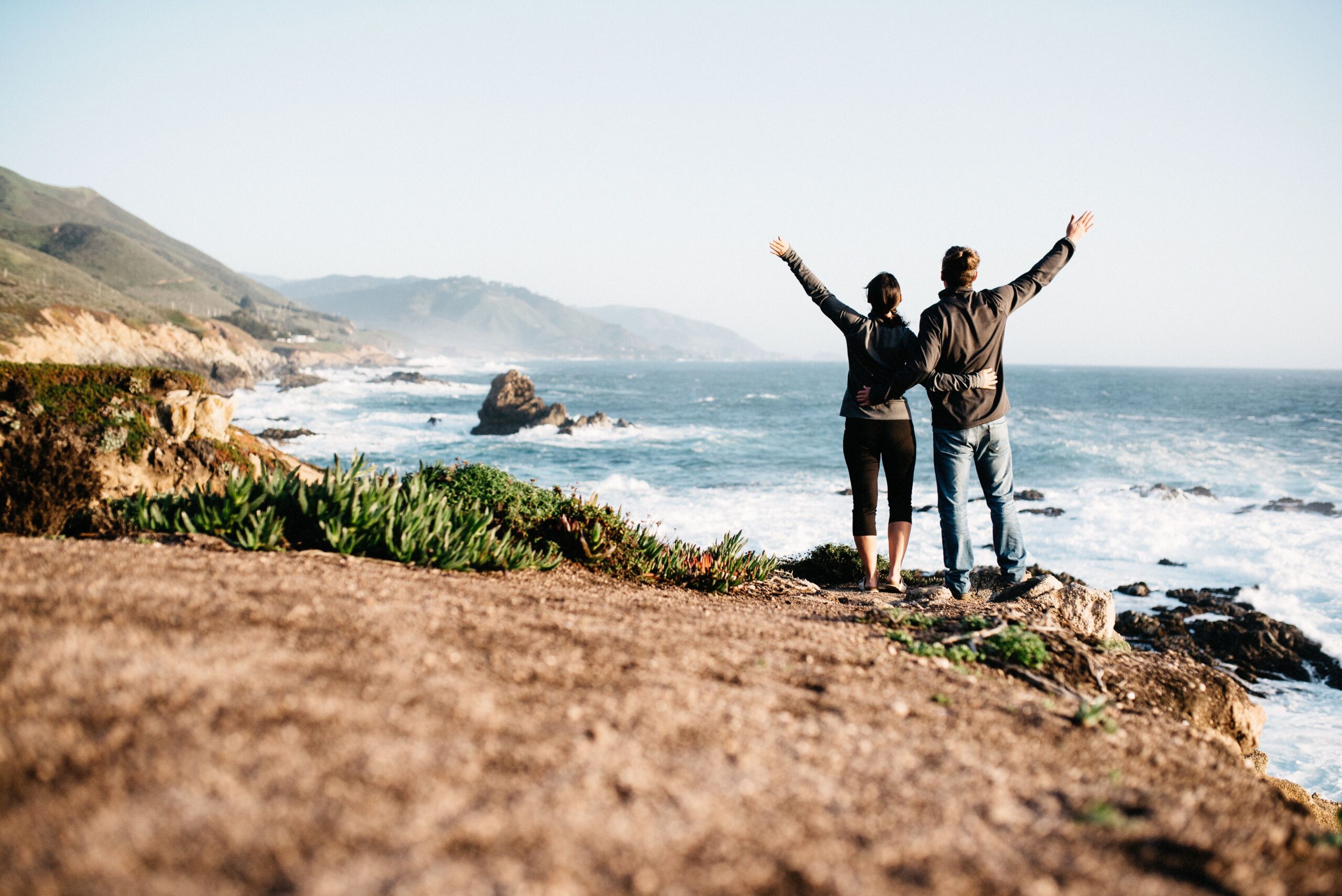 Bianca and Tom looking across the Pacific coast in California