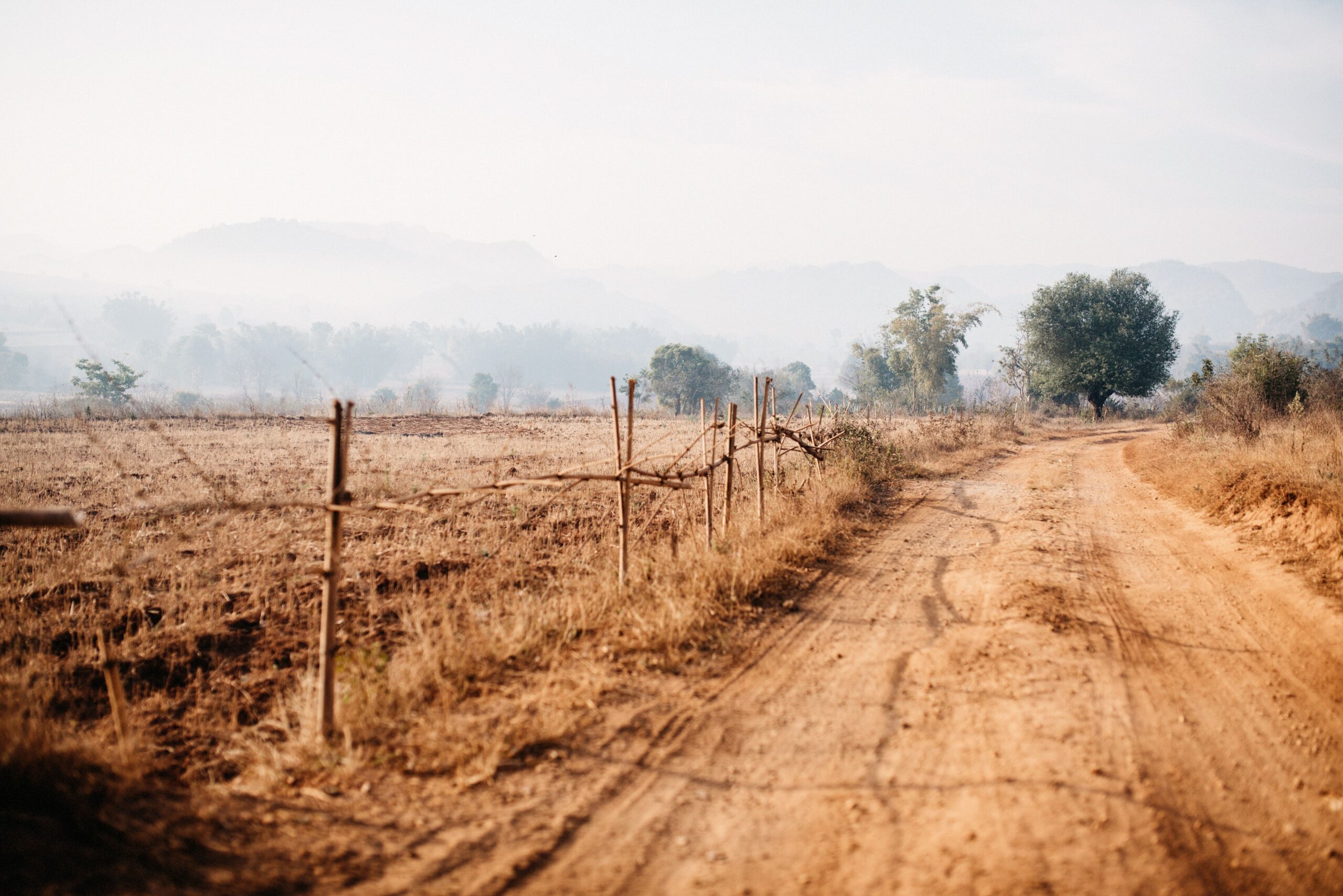 Tom hiking across the dry countryside between Kalaw and Inle Lake