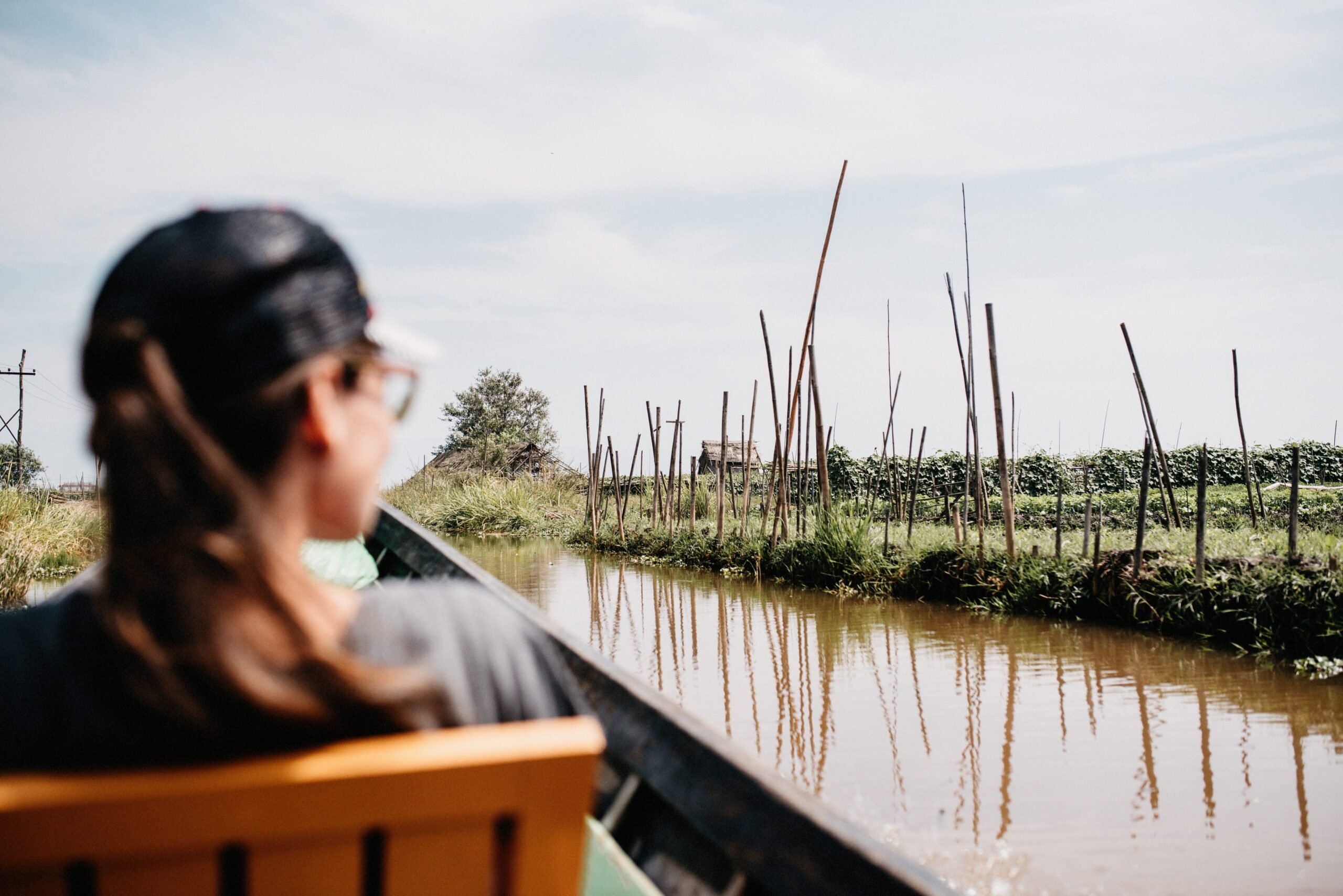 Bianca watching the floating gardens from the boat to Nyaung Shwe