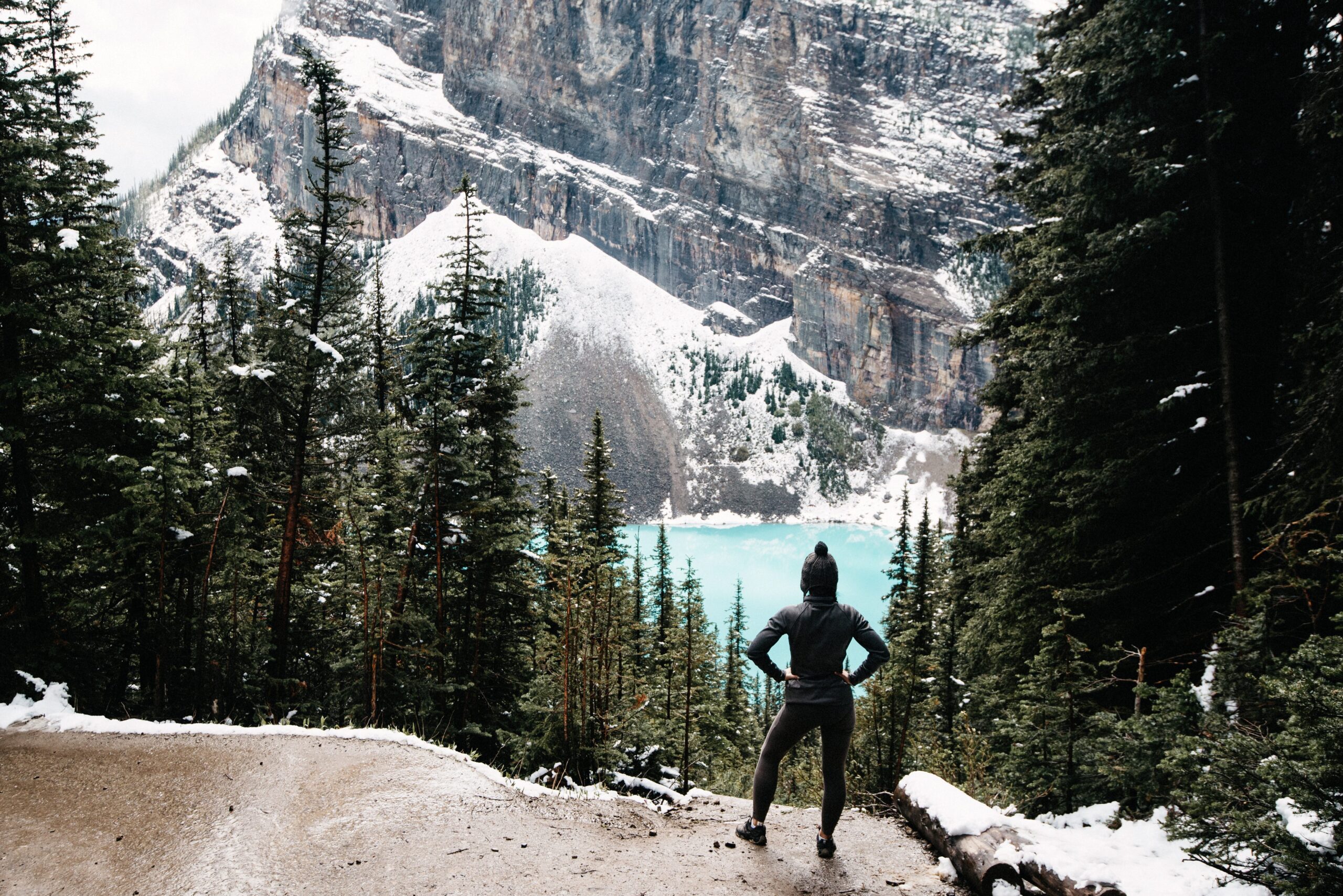 Tom looking across Lake Louise from a snowy trail