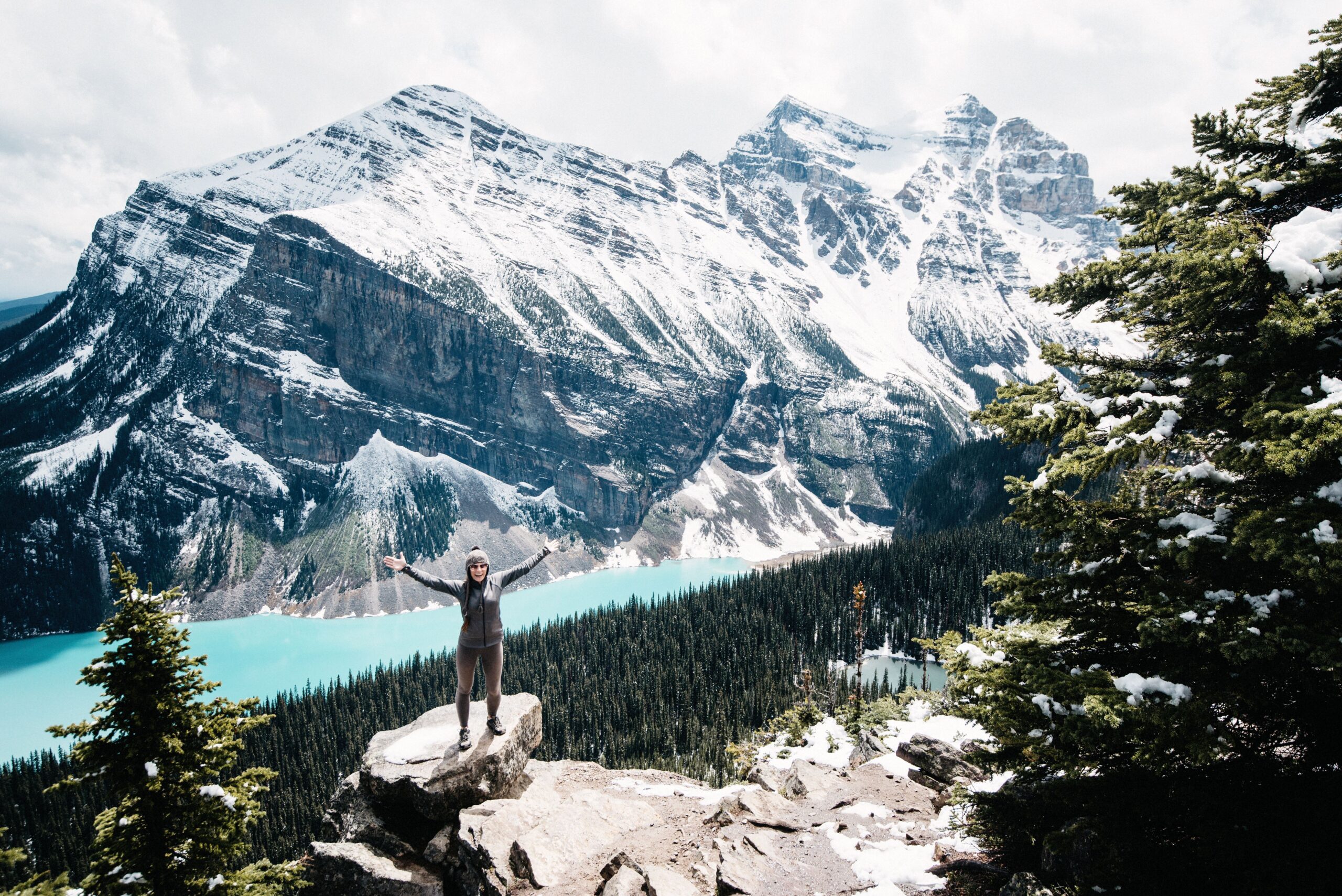 Bianca above a turquoise lake in the Canadian Rockies