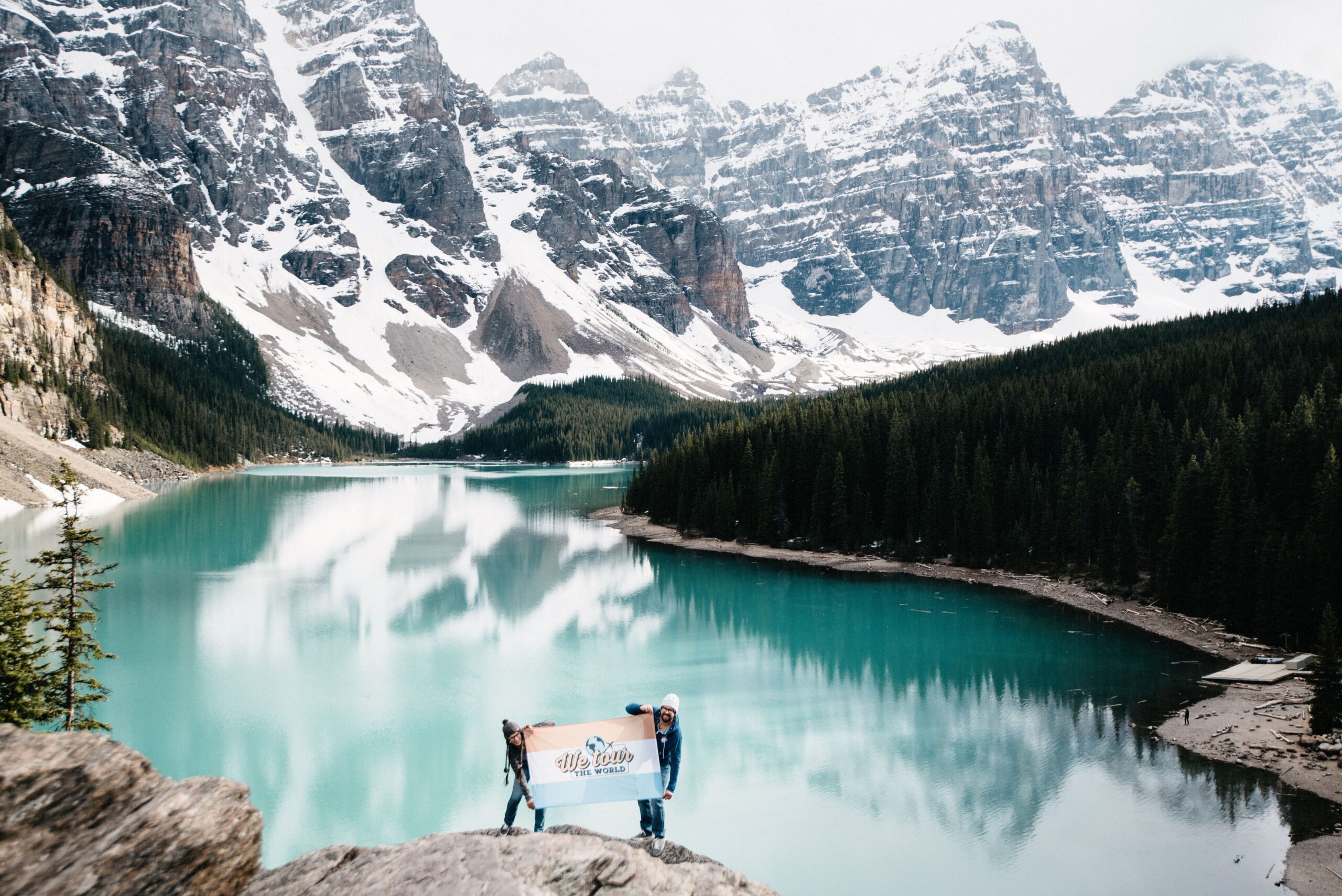 The turquoise water and mountain peaks of Moraine Lake in late spring