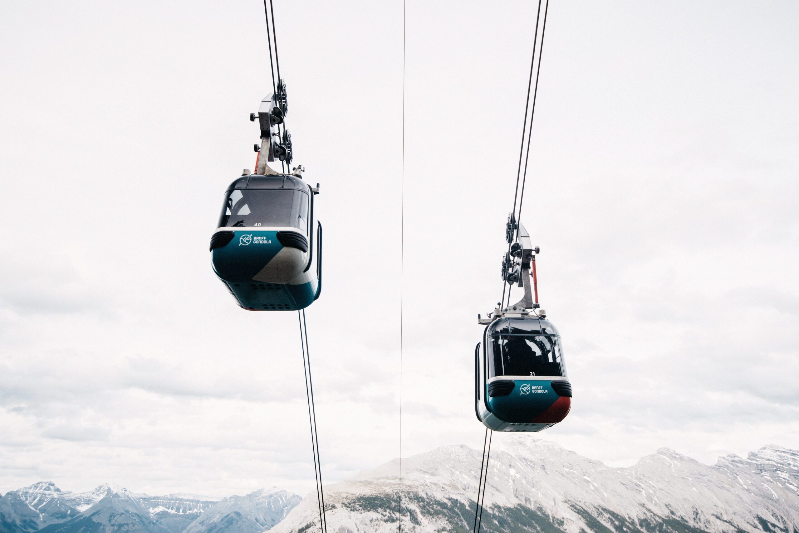 Gondola cabins travelling above the mountains near Banff