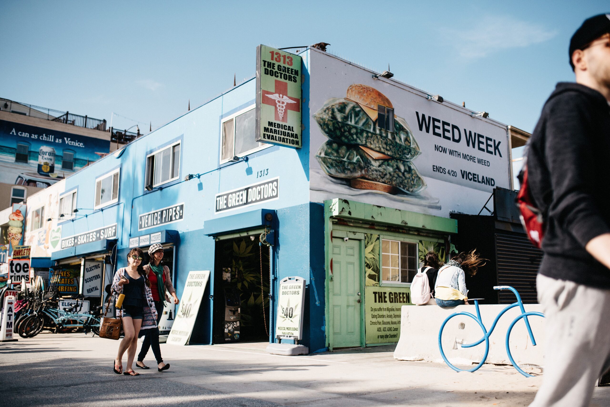 Shops and pedestrians along the Venice Beach boardwalk