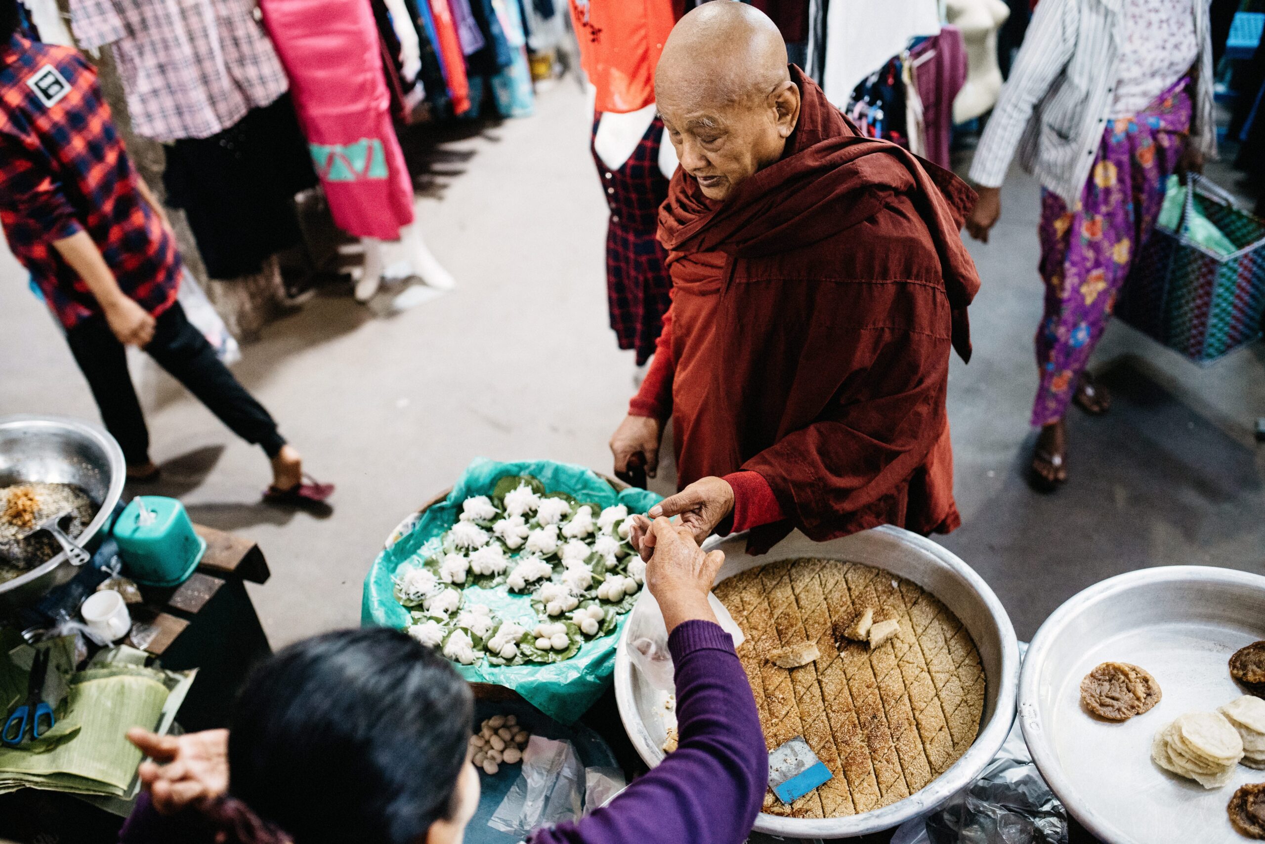 A Buddhist monk shopping at a Mandalay market