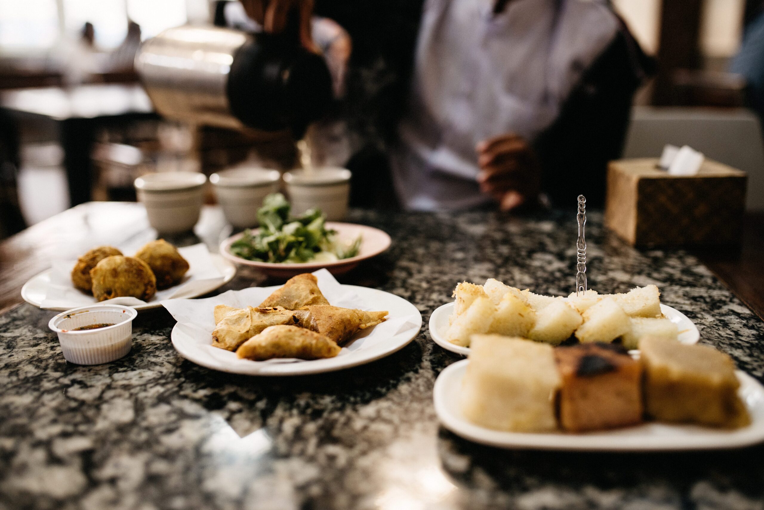 Burmese cakes and savoury snacks served in a Mandalay tea house