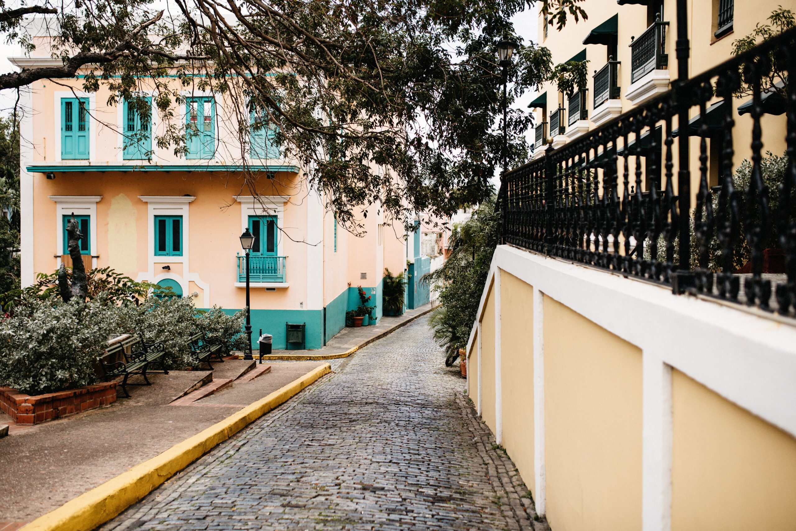 A colourful cobbled street descending through Old San Juan