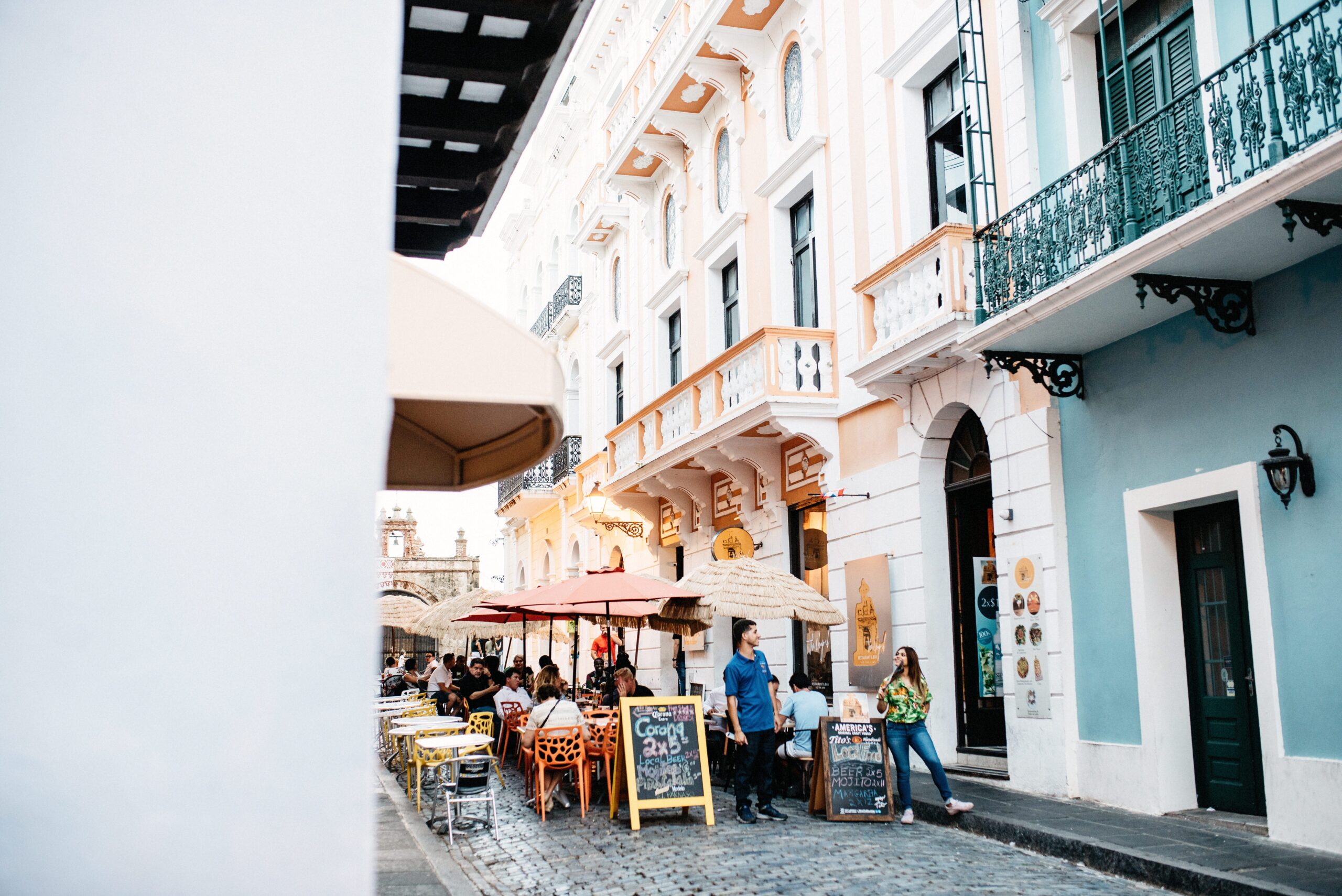 Cafés and balconies along a street in Old San Juan