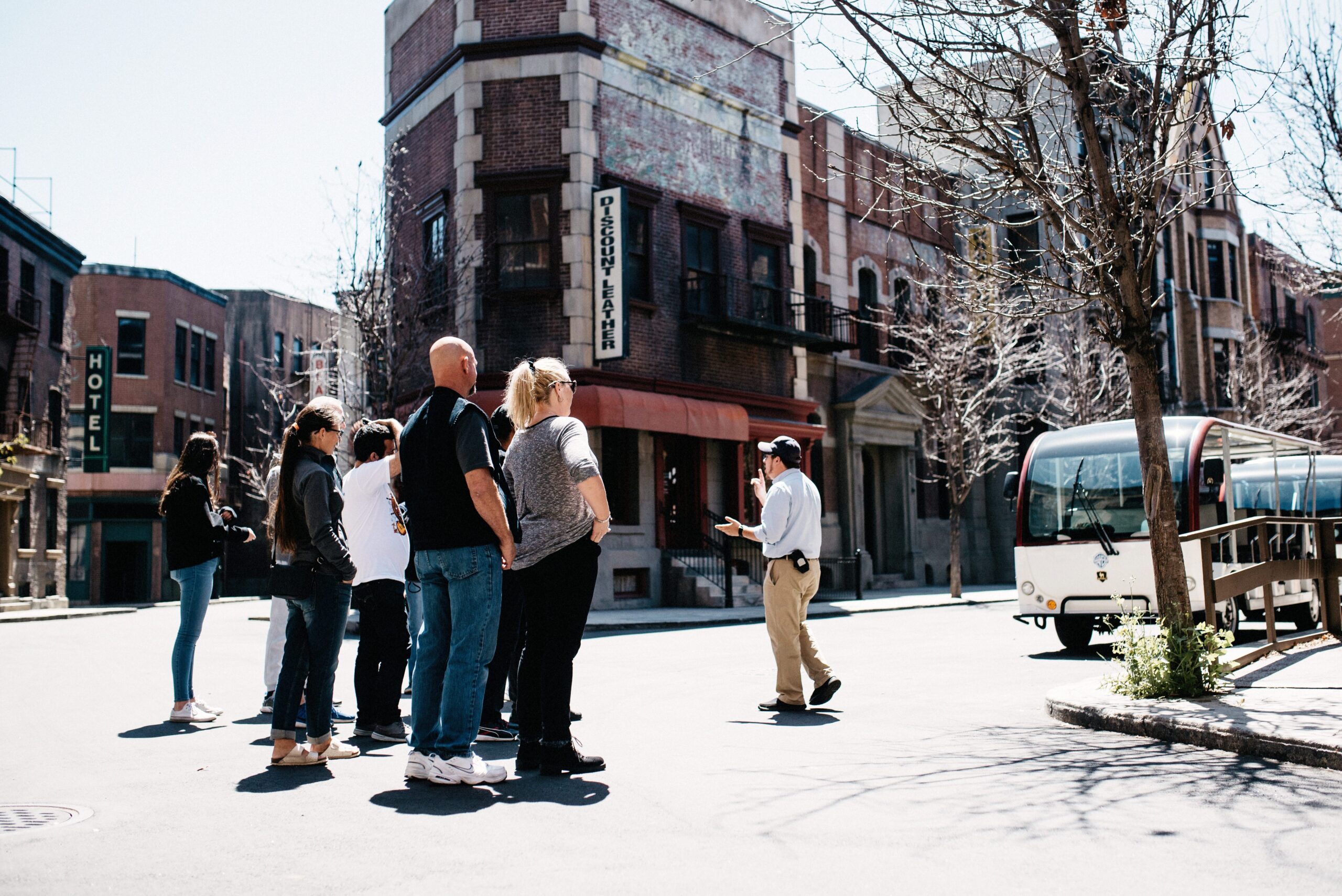 A tour group walking through the Warner Bros. outdoor backlot