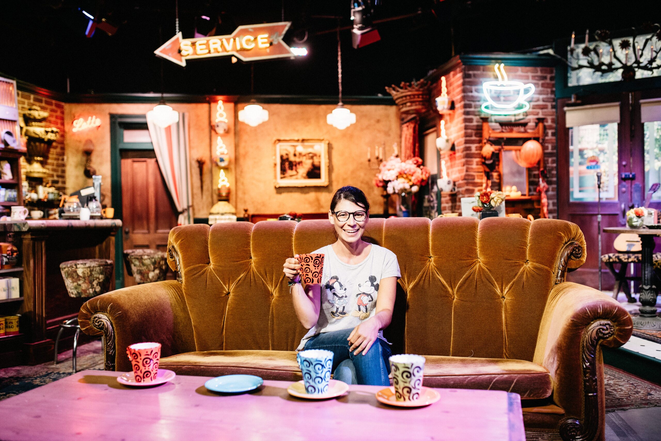 Bianca sitting on the Central Perk sofa from Friends