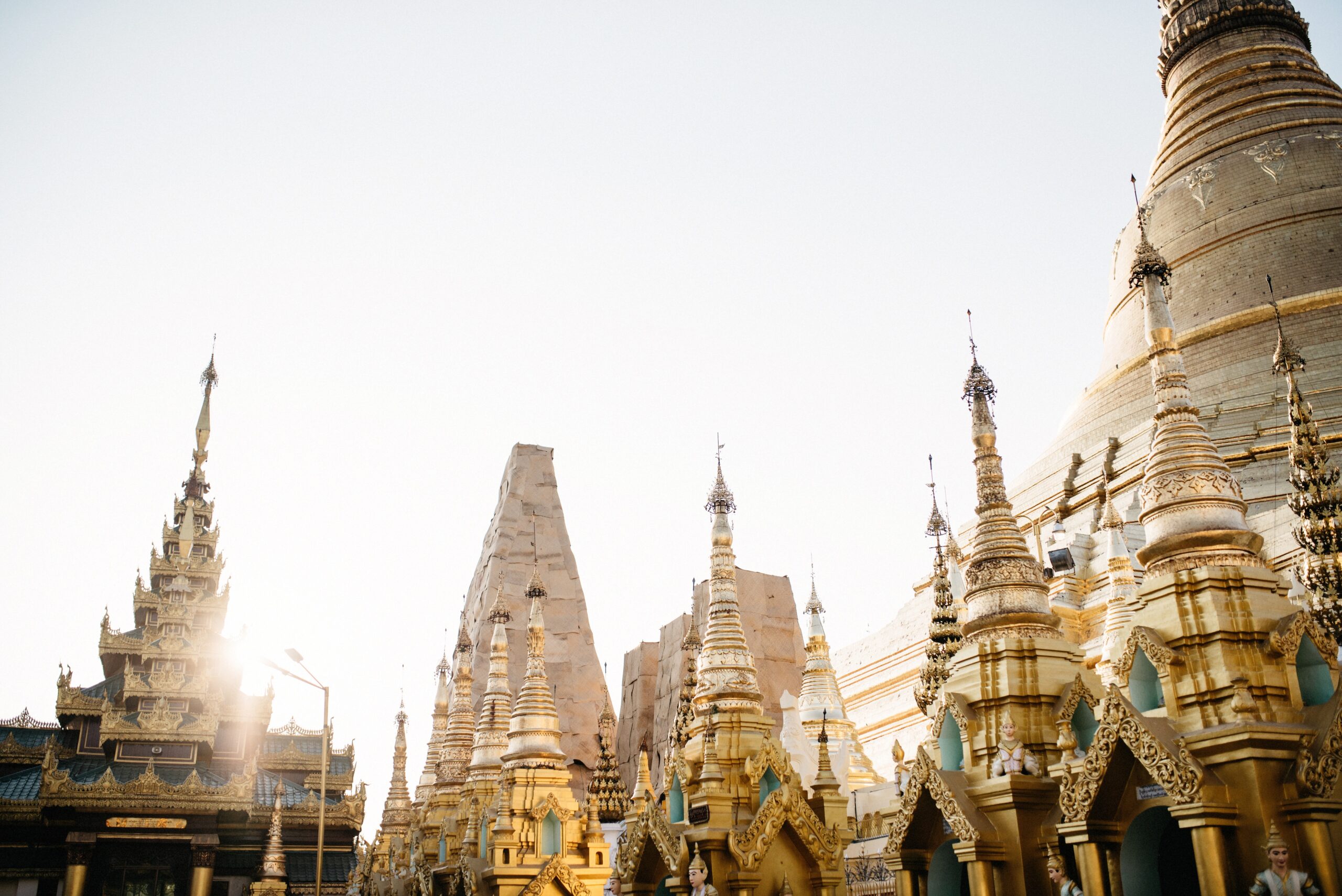 White and golden stupas across the Shwedagon Pagoda complex