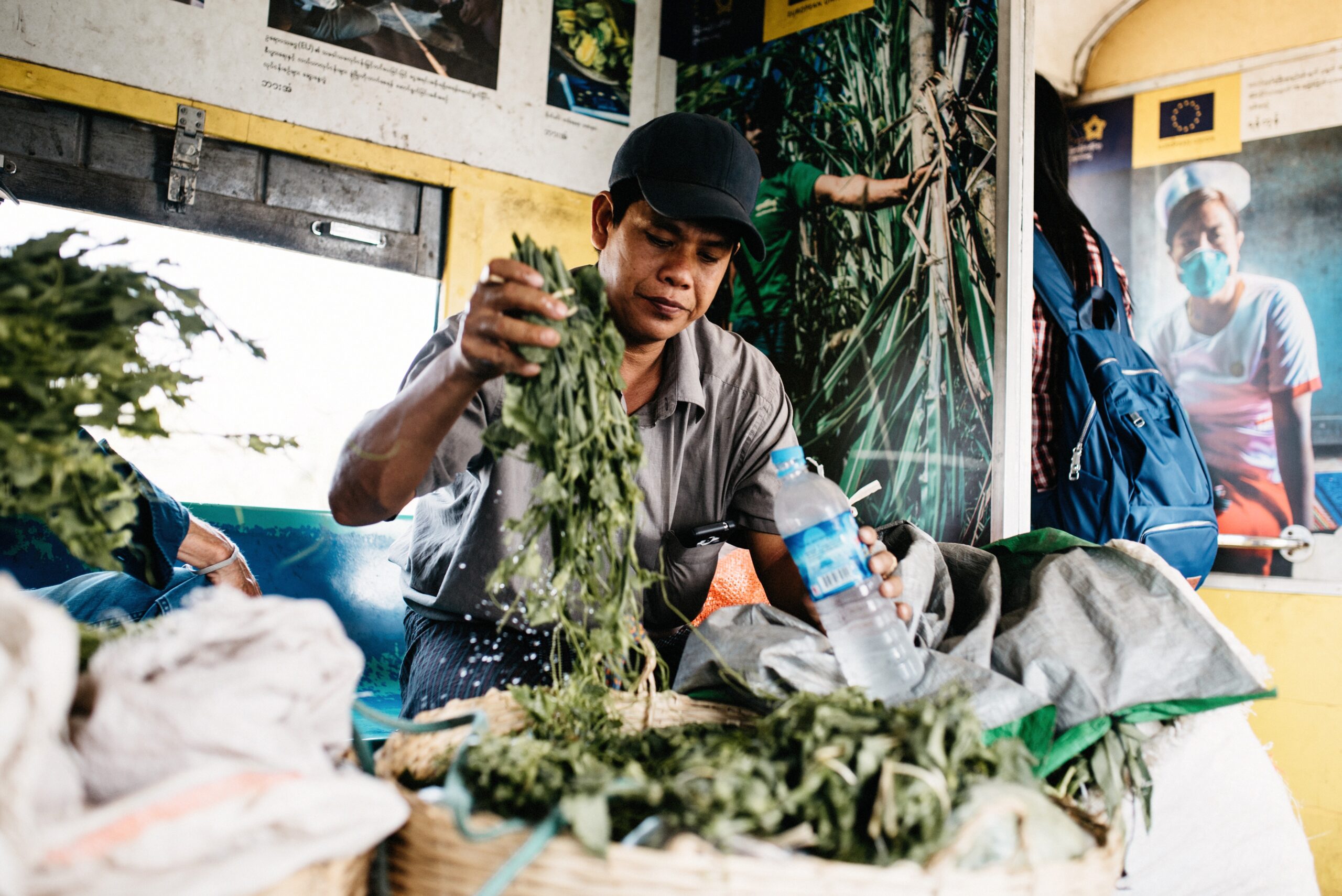 A trader preparing vegetables inside the Circular Train