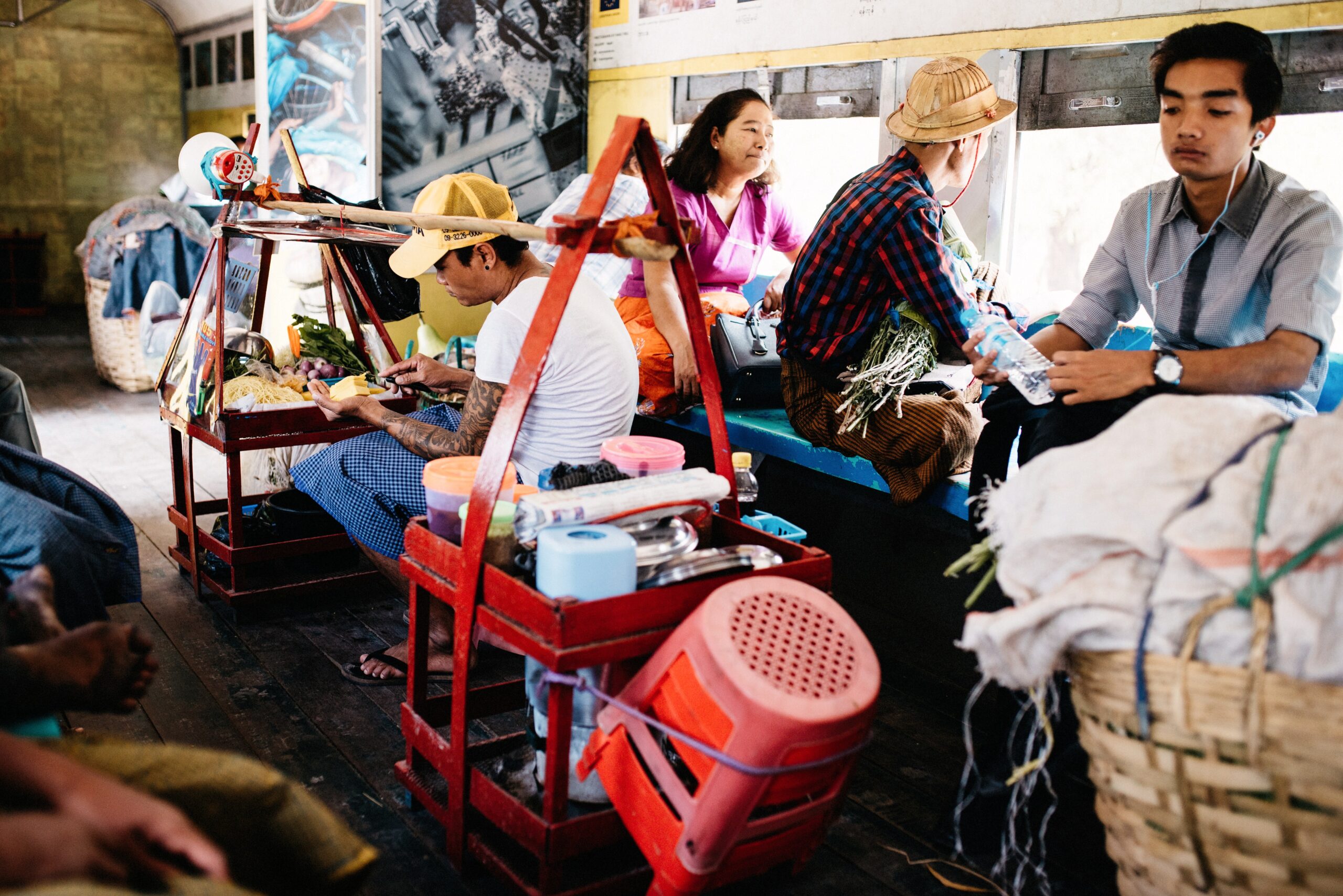 Passengers sorting produce on a bench inside the Circular Train