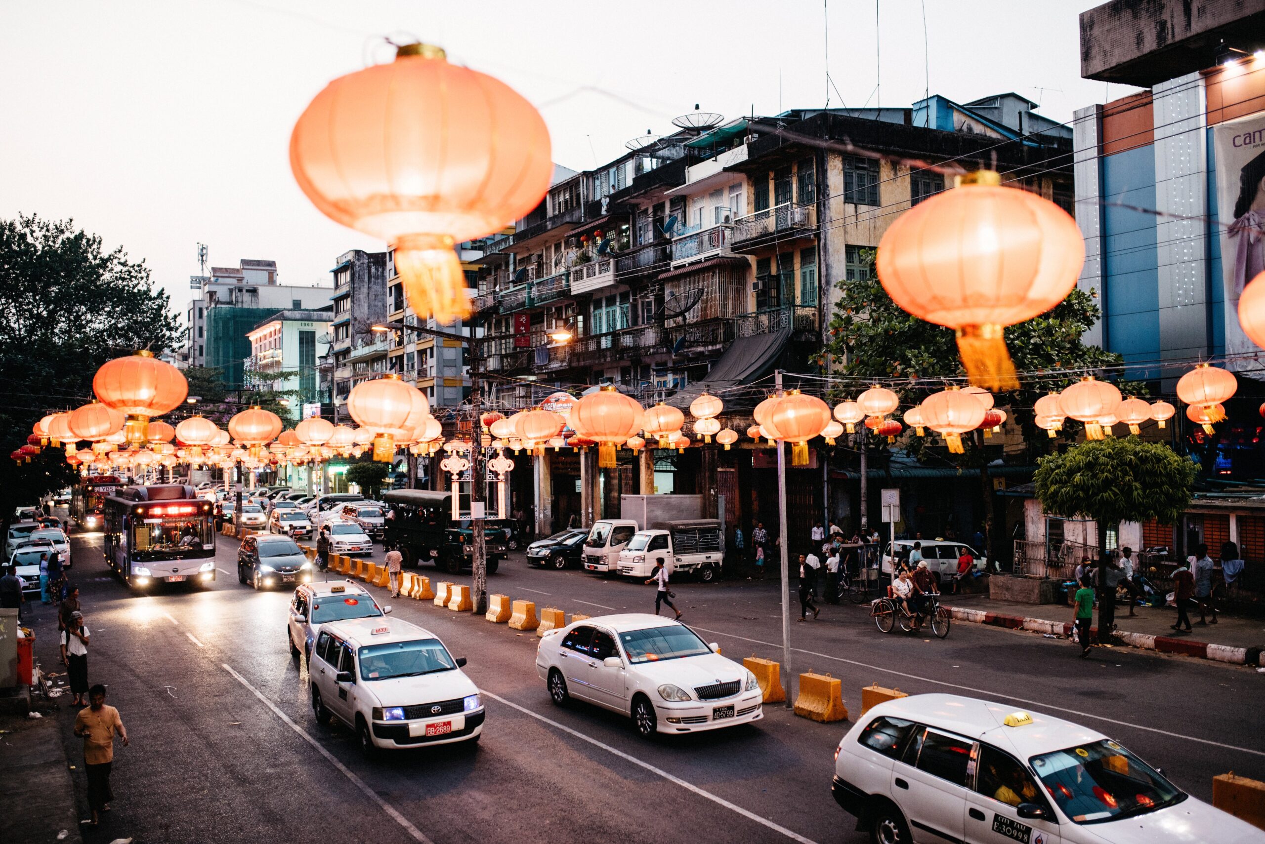 Evening traffic and illuminated buildings in downtown Yangon