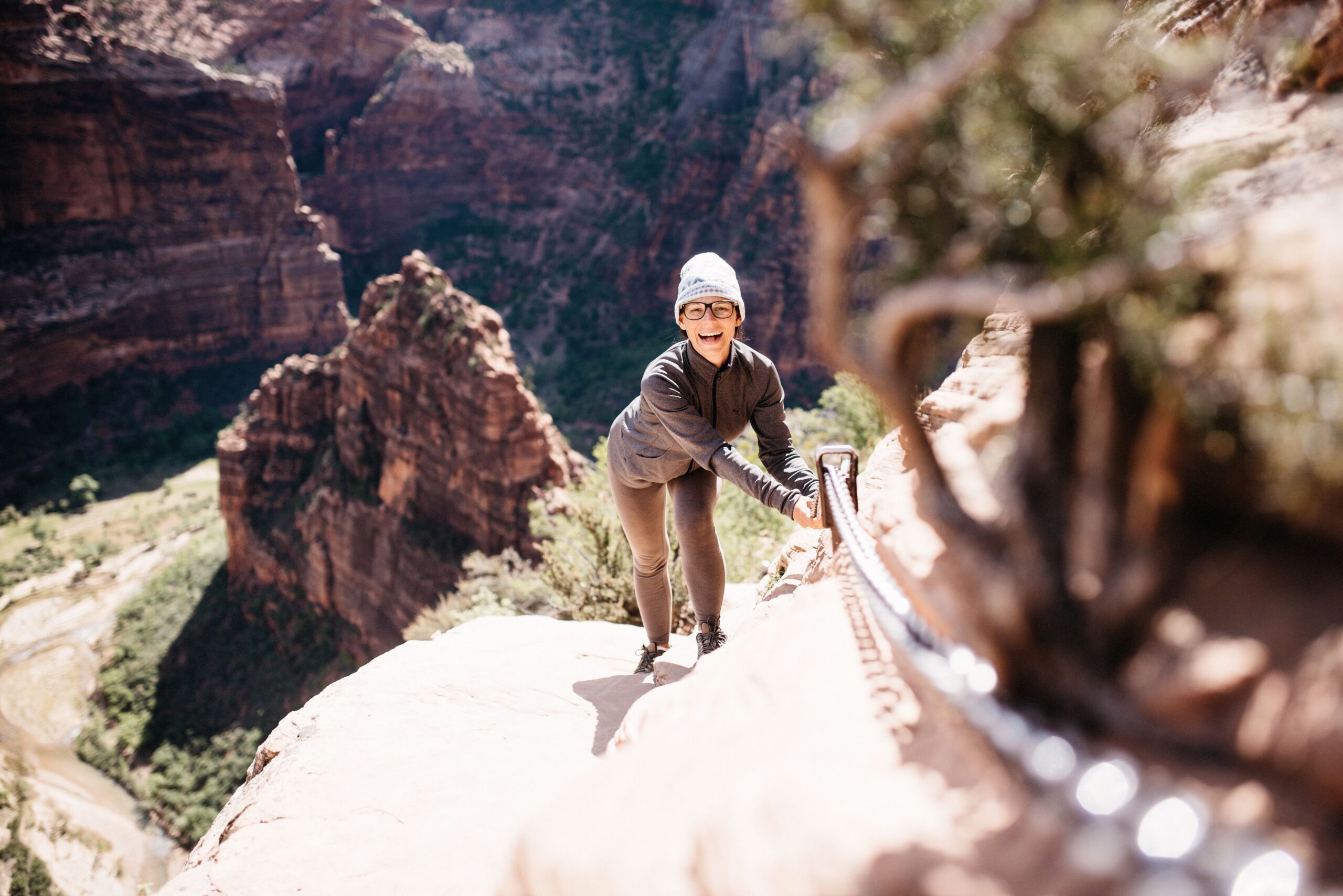 Bianca holding the chains on the exposed Angel's Landing trail
